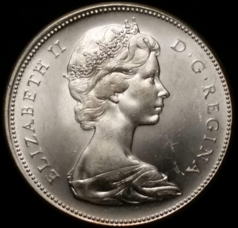 1967-Canadian-Dollar-Off-Center-Strike-Or-Soft-Struck-Edge?